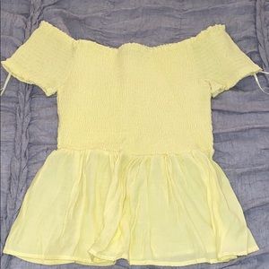 pastel yellow off the shoulder shirt